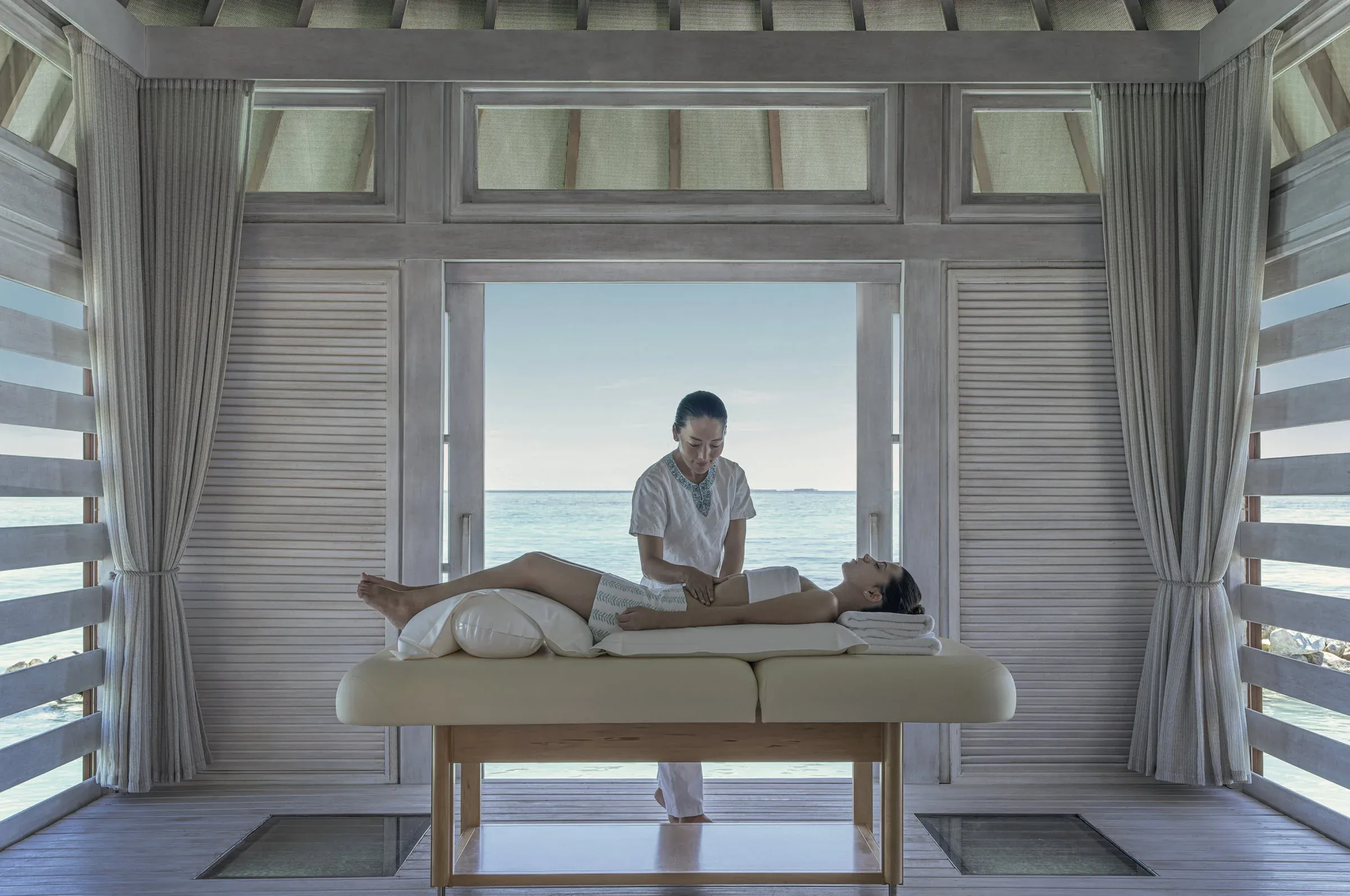 Overwater treatment pavilion at ŪRJĀ Naturopathy Island, Four Seasons Resort Maldives at Kuda Huraa