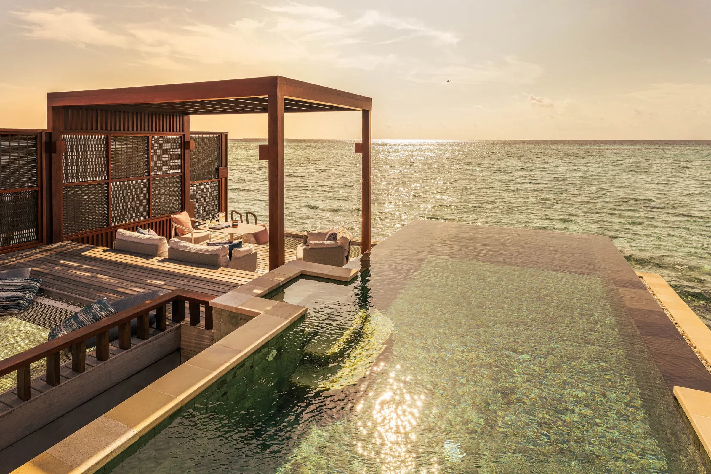 Sunset Water Villa with Pool deck at Four Seasons Resort Maldives at Kuda Huraa