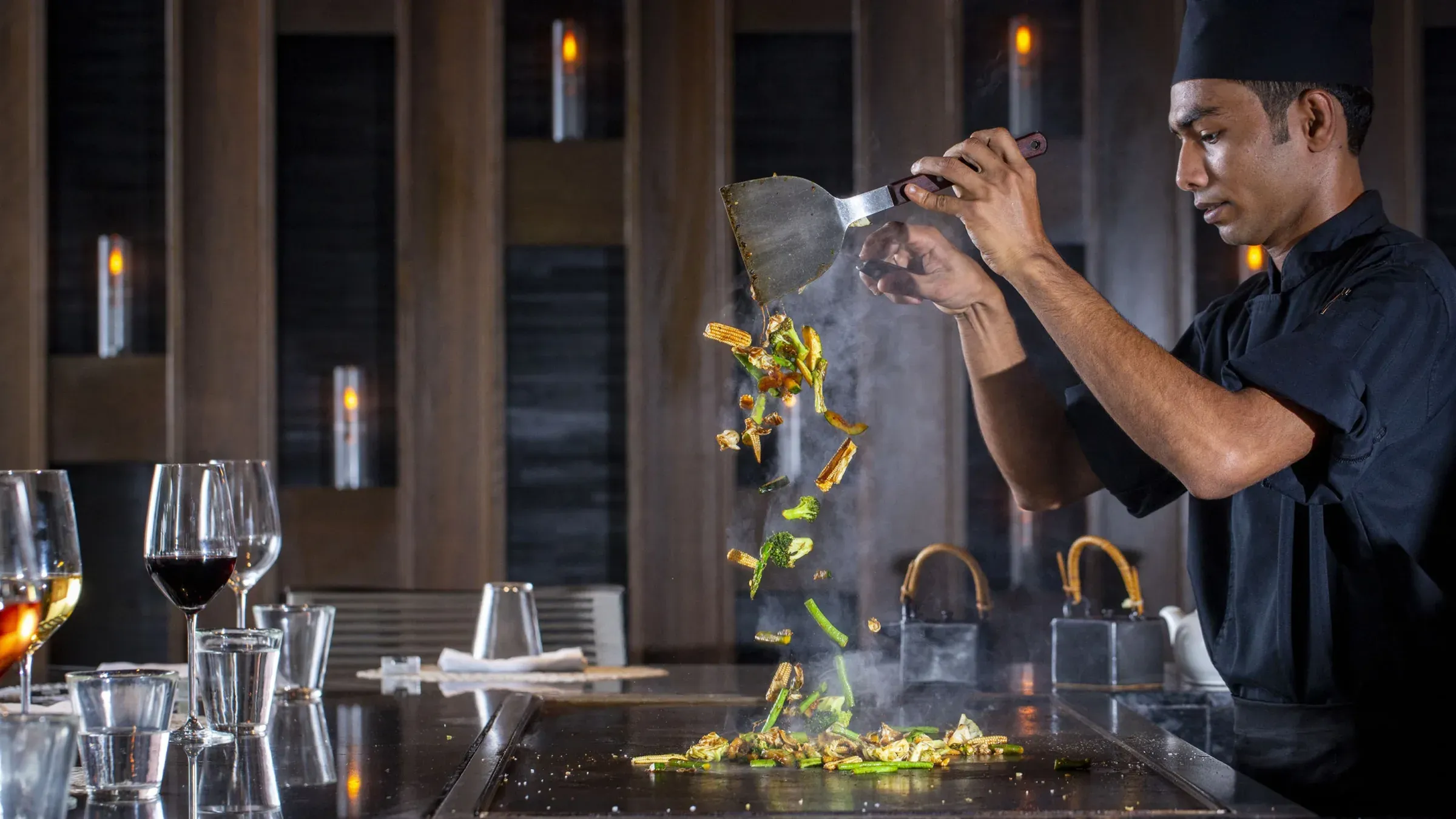 Thatched-roof dining pavilion at Café Landaa, Four Seasons Landaa Giraavaru