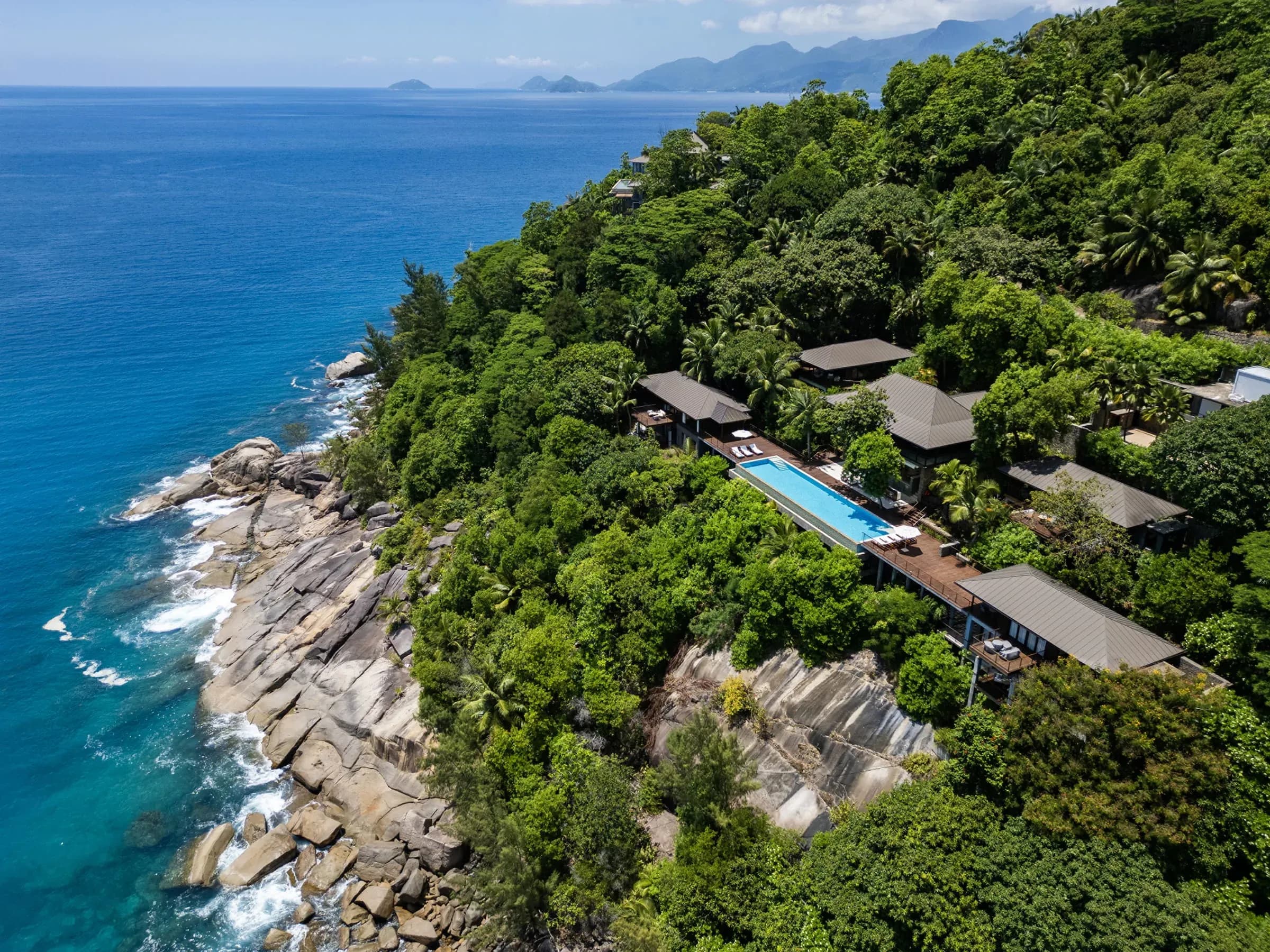 The Seven-Bedroom Residence Villa set on a lush cliff overlooking the sea at Four Seasons Resort Seychelles
