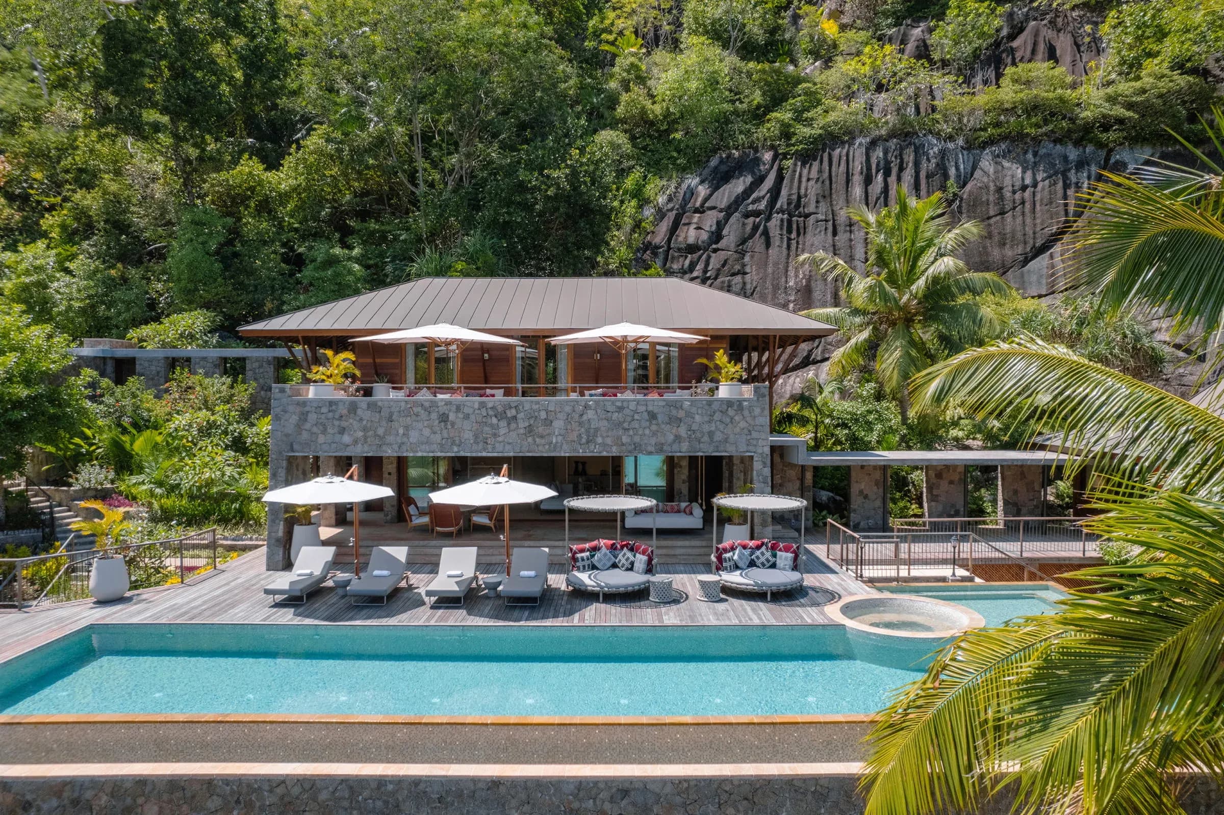 Exterior of the Three-Bedroom Royal Suite with its large private pool and pool deck at Four Seasons Resort Seychelles