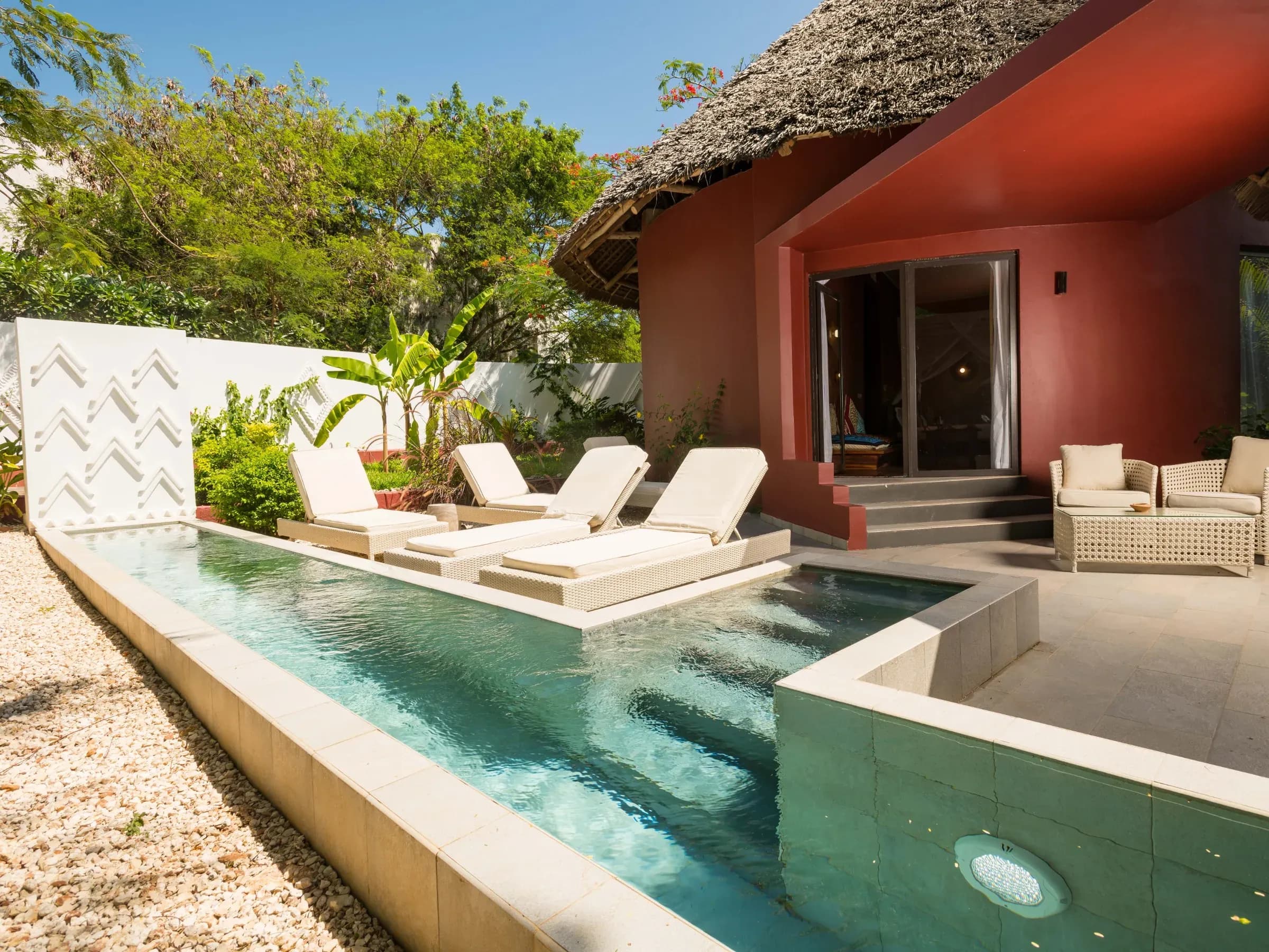 Jungle Villa exterior with private plunge pool set in tropical garden at Gold Zanzibar