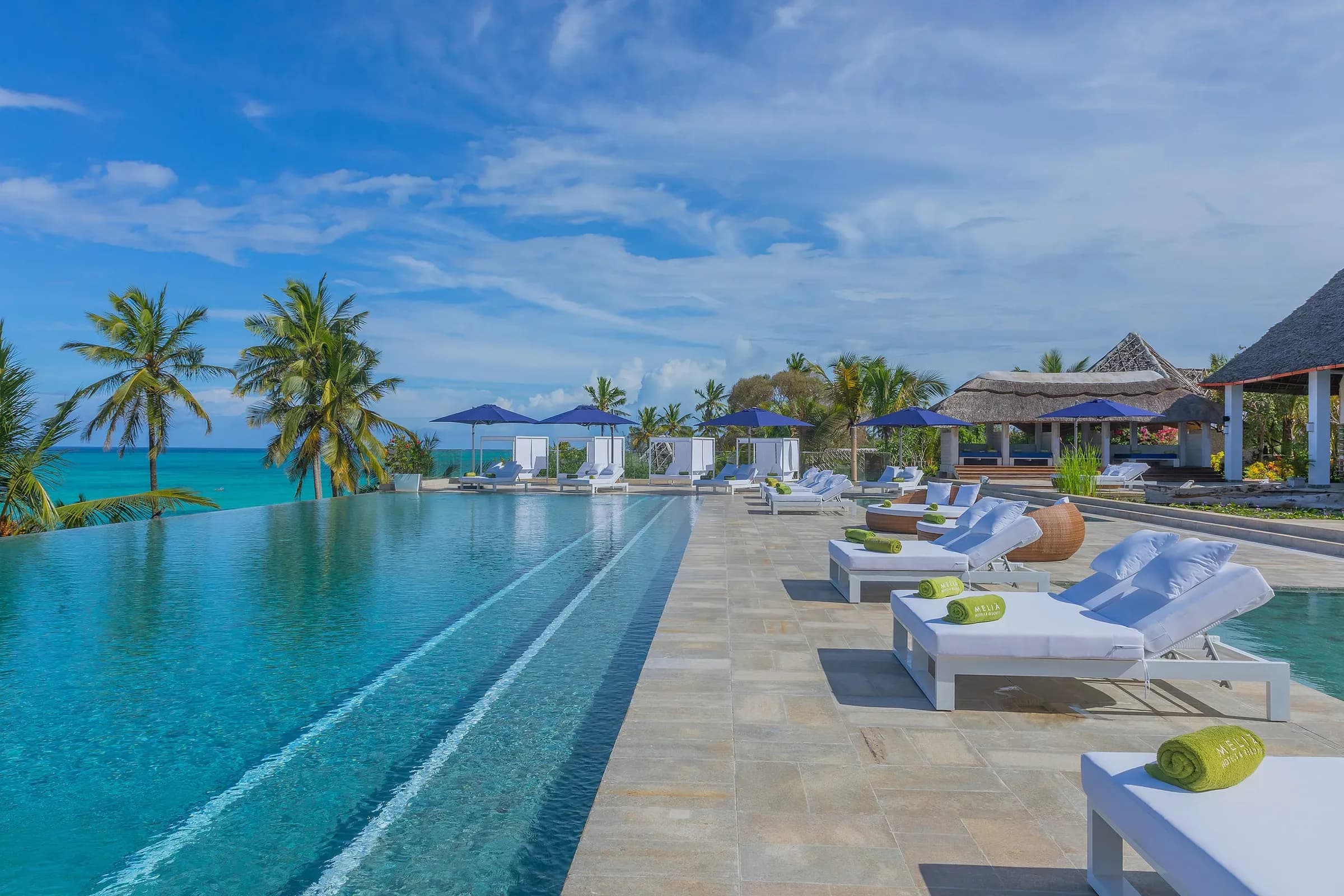 Infinity pool and beachfront loungers overlooking the Indian Ocean at Meliá Zanzibar, Kiwengwa