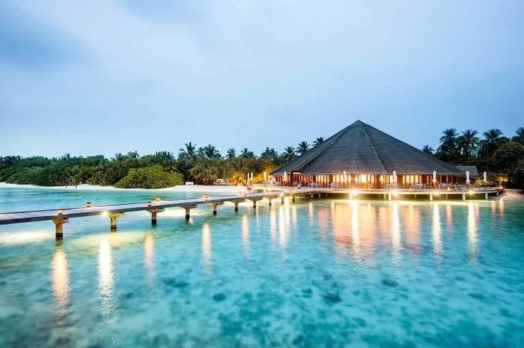 Matheefaru overwater restaurant at dusk, Hideaway Beach Resort & Spa