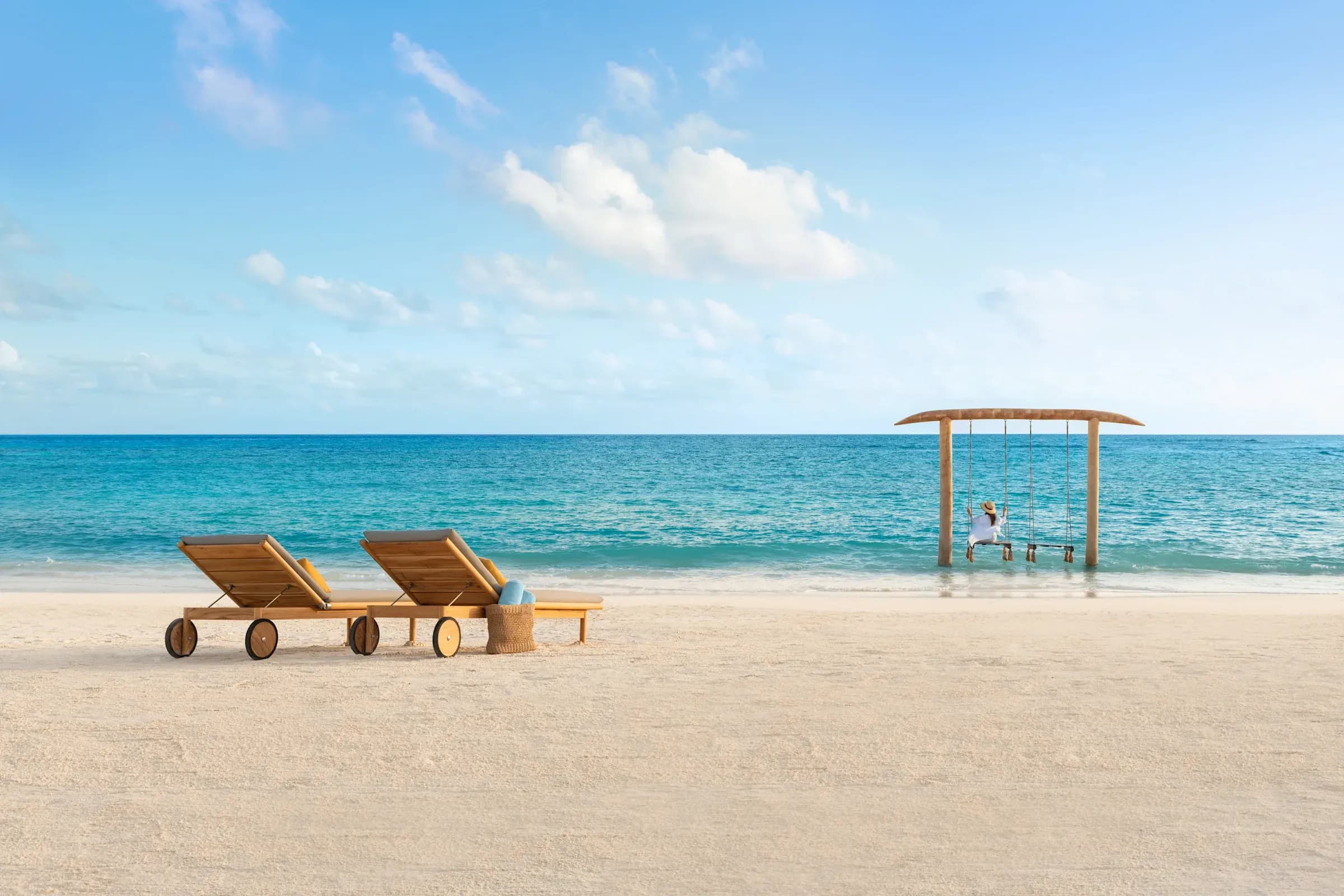 White-sand beach and turquoise lagoon at Hilton Maldives Amingiri Resort & Spa
