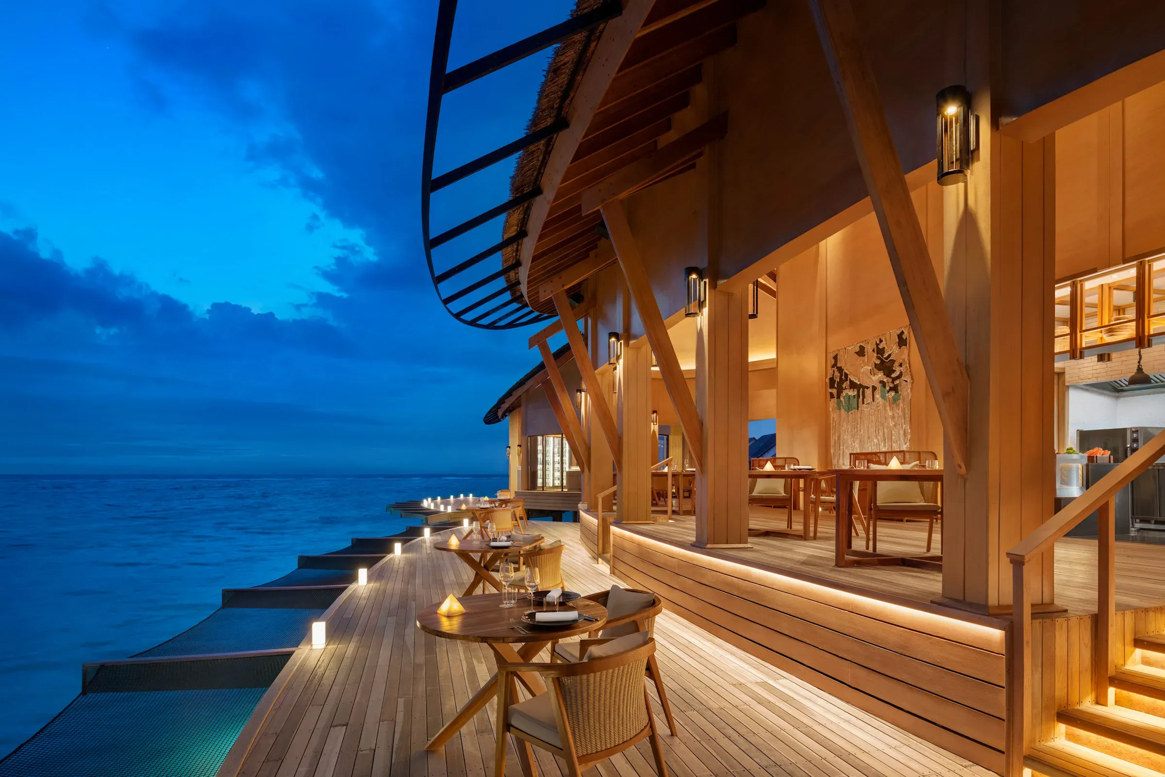 Origin overwater restaurant setting at Hilton Maldives Amingiri Resort & Spa
