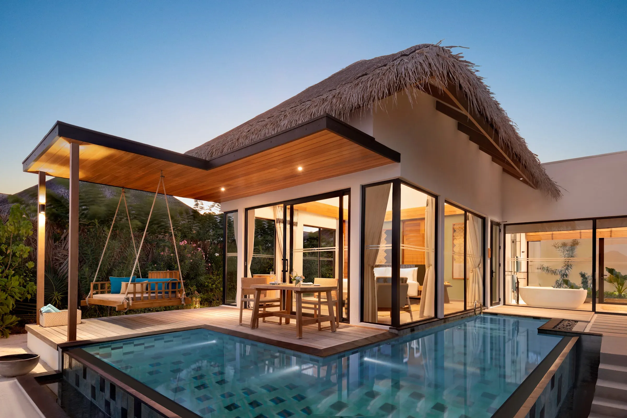 One-Bedroom Beach Pool Villa exterior and private pool at Hilton Maldives Amingiri