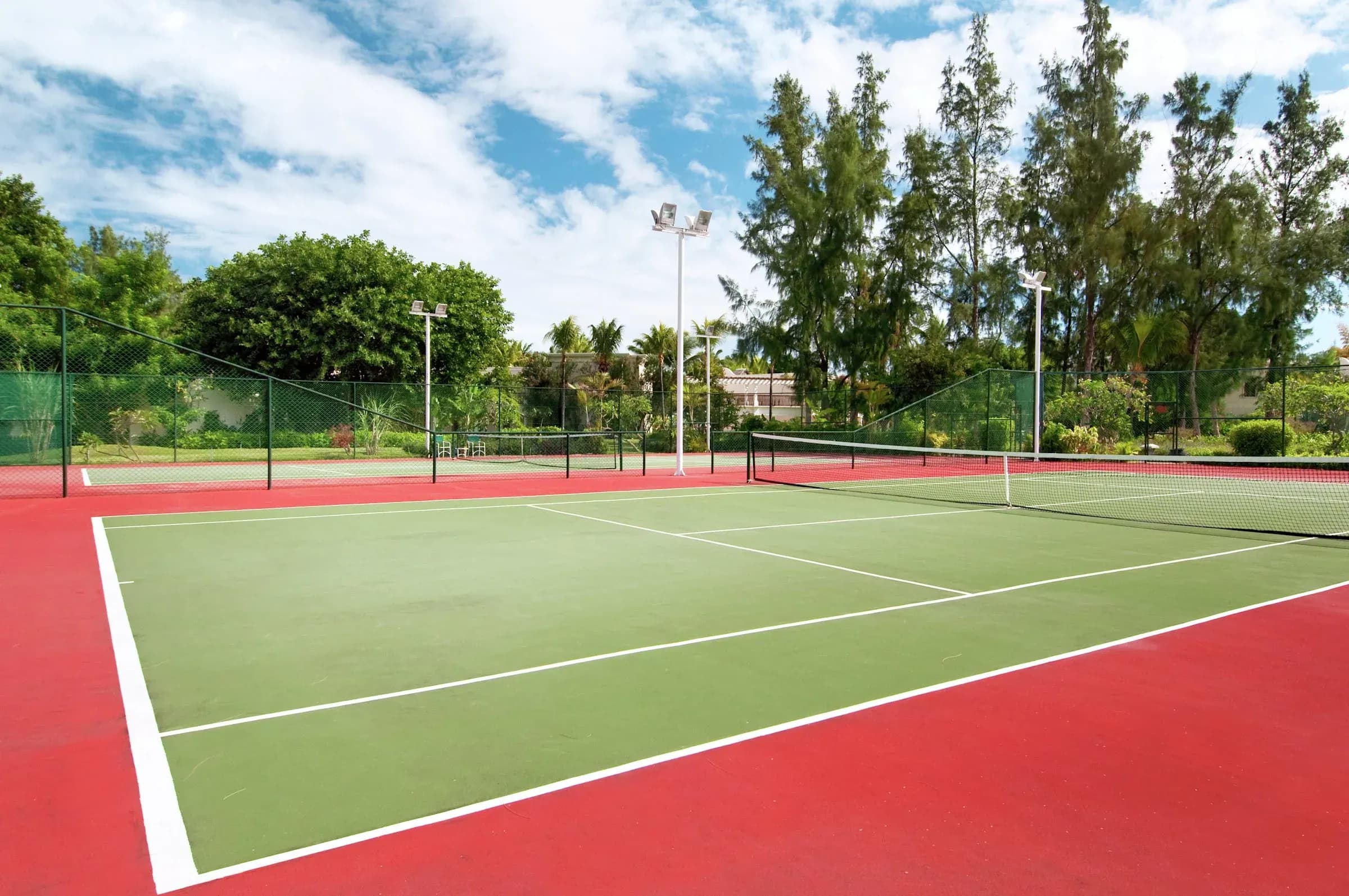 Floodlit tennis court at Hilton Mauritius Resort & Spa