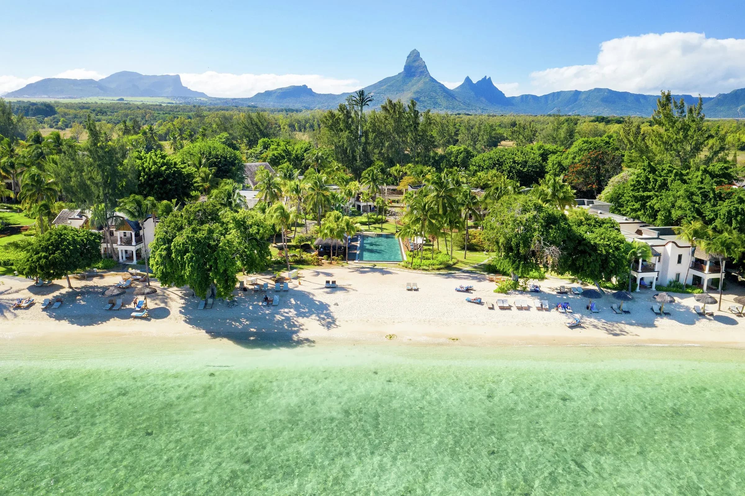 Aerial view of Hilton Mauritius Resort & Spa's beach, pool and gardens with Trois Mamelles mountains behind, Wolmar, Mauritius