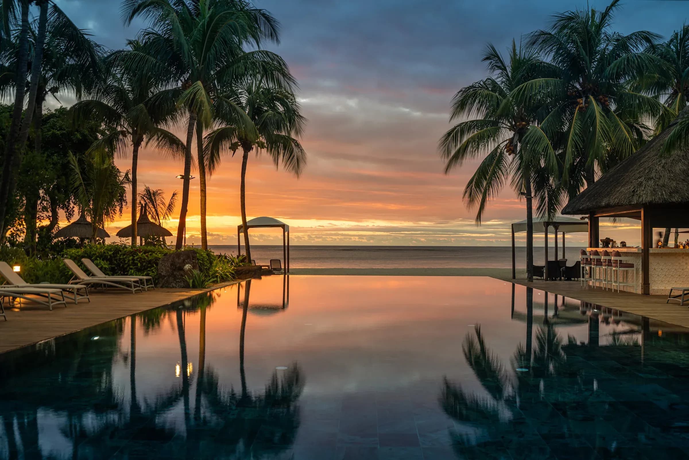 Sunset over the infinity pool at Hilton Mauritius Resort & Spa, west coast Mauritius
