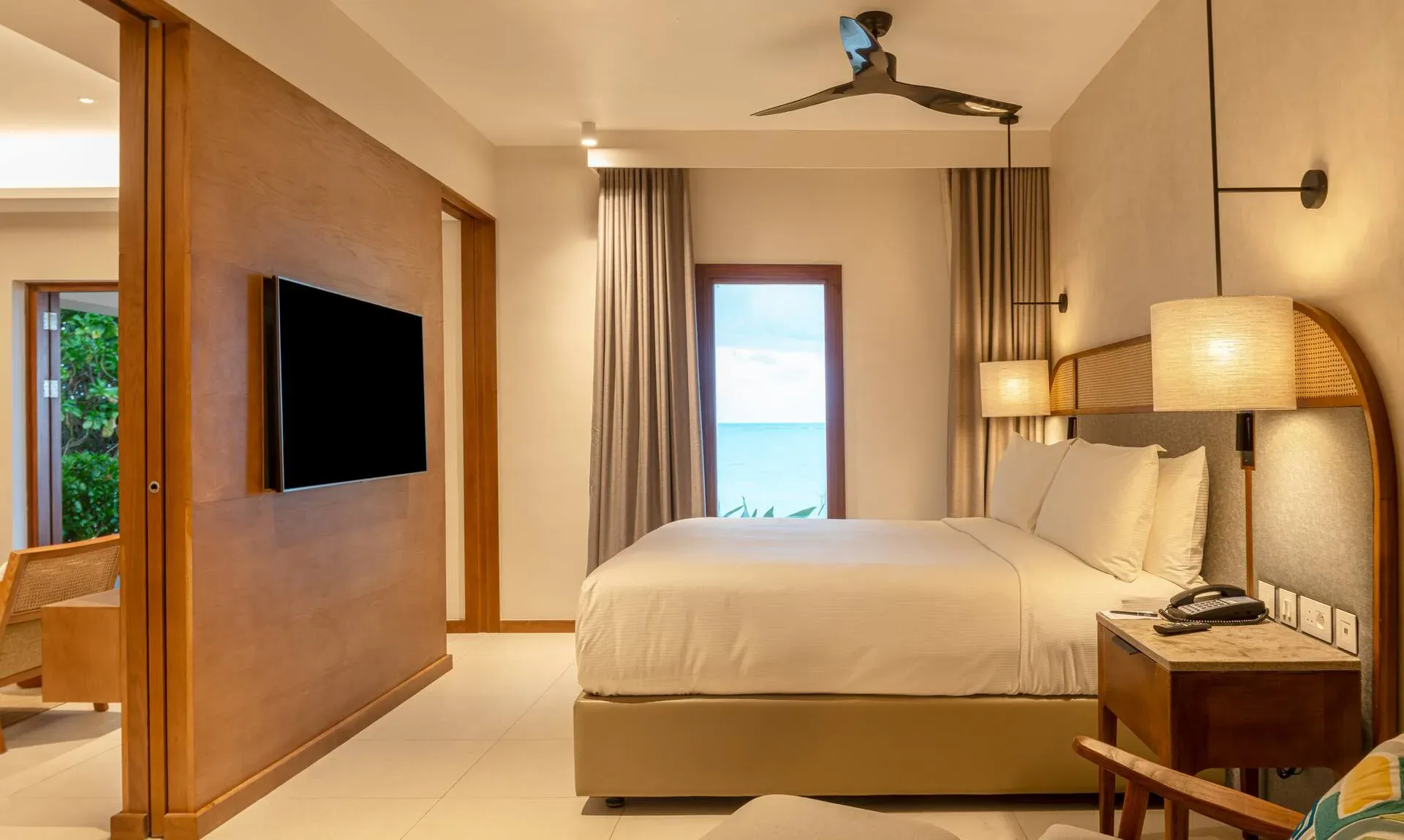Beachfront Junior Suite bedroom at Hilton Mauritius Resort & Spa