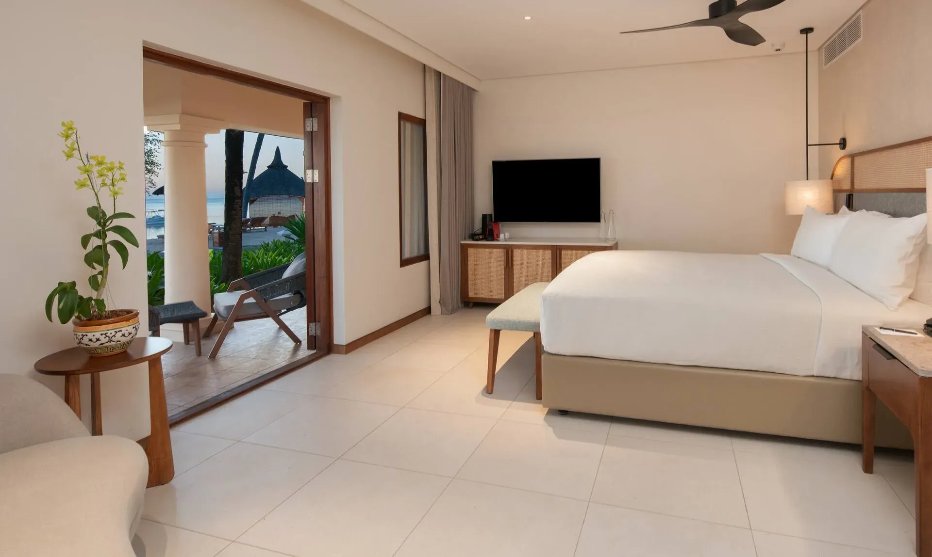 Beachfront Room bedroom at Hilton Mauritius Resort & Spa