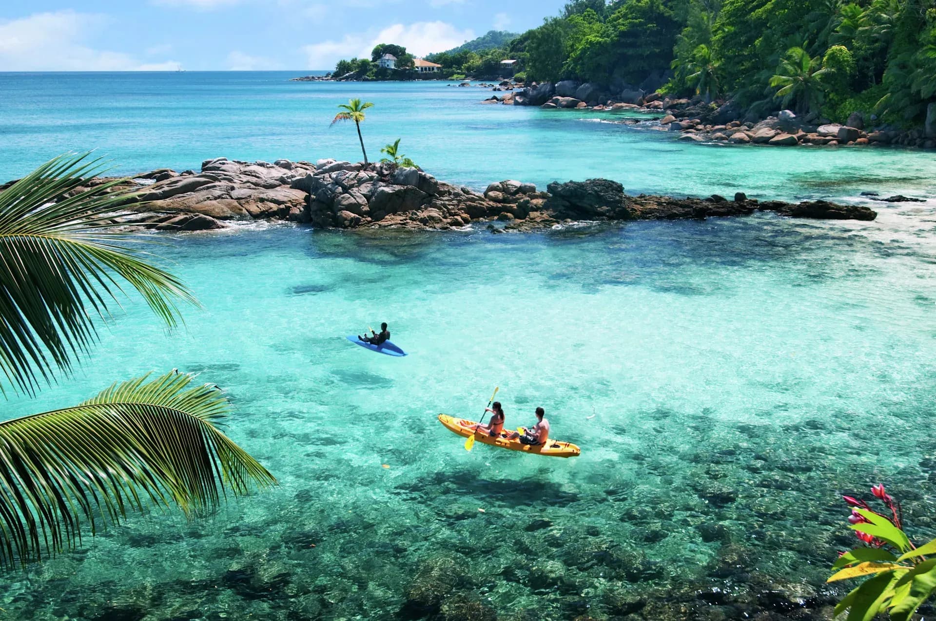 Guest kayaking as part of the resort's complimentary watersports at Hilton Seychelles Northolme