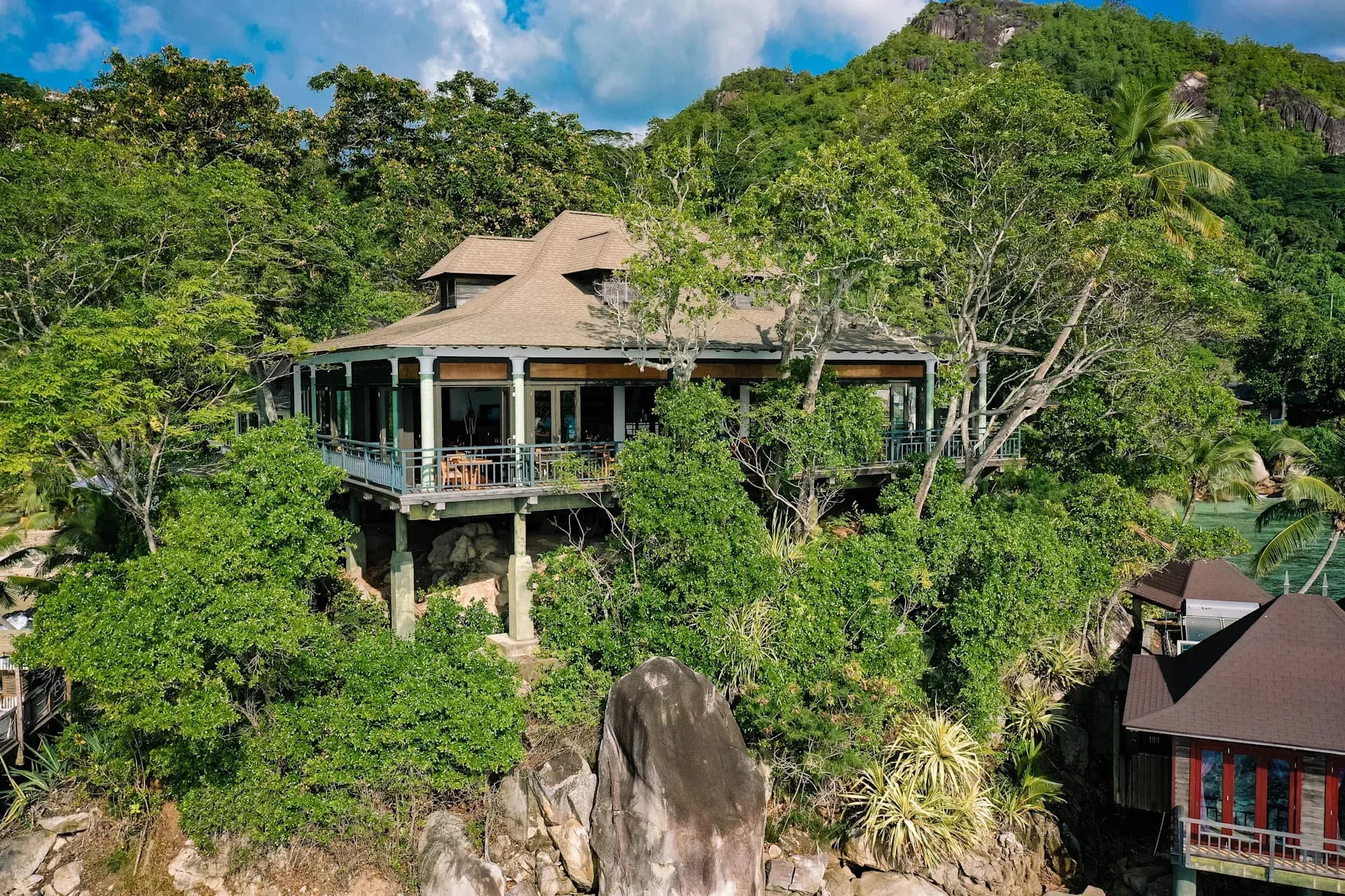 Aerial view of Mahé Restaurant's oceanfront dining terrace at Hilton Seychelles Northolme