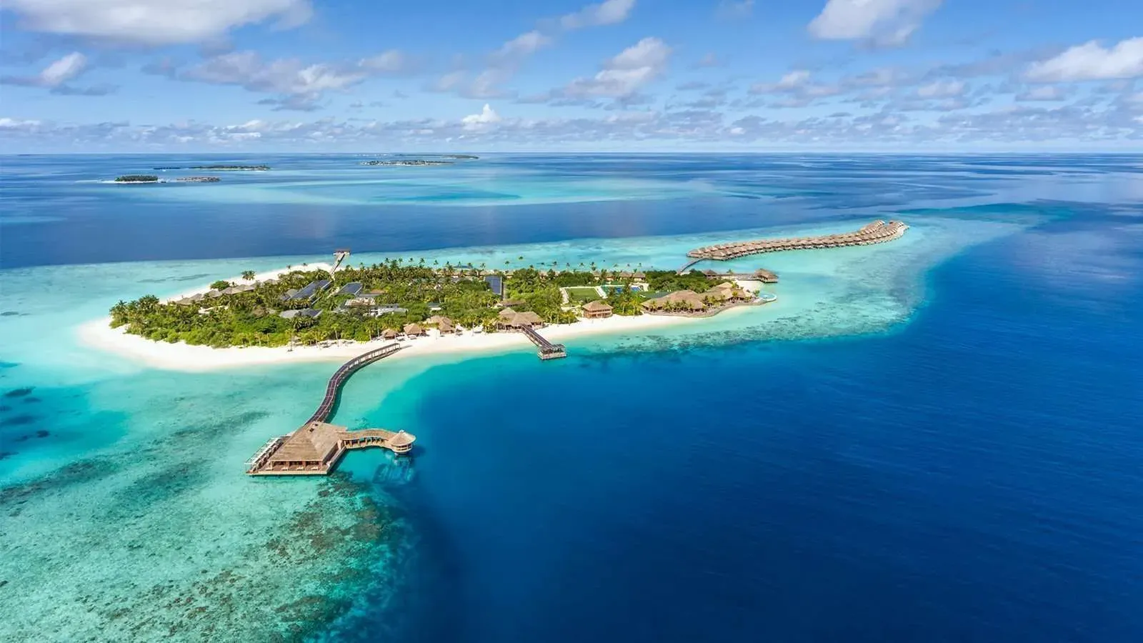 Aerial view of Hurawalhi Island Resort's reef and villa jetties, Maldives