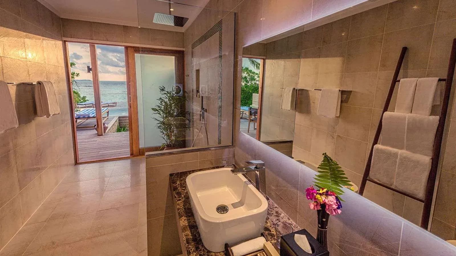 Beach Sunset Pool Villa at sunset at Hurawalhi Island Resort