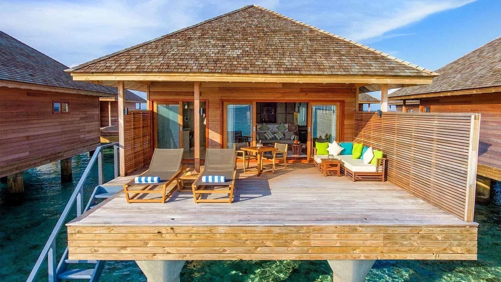 Ocean Villa interior with sitting area at Hurawalhi Island Resort