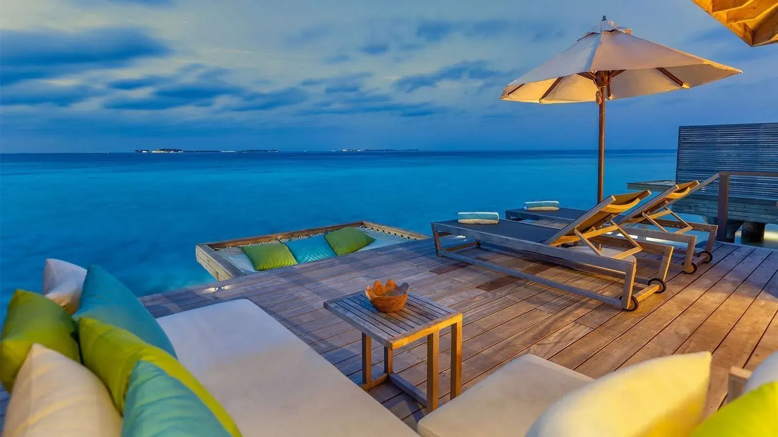 Romantic Ocean Villa terrace with outdoor bathtub at Hurawalhi Island Resort