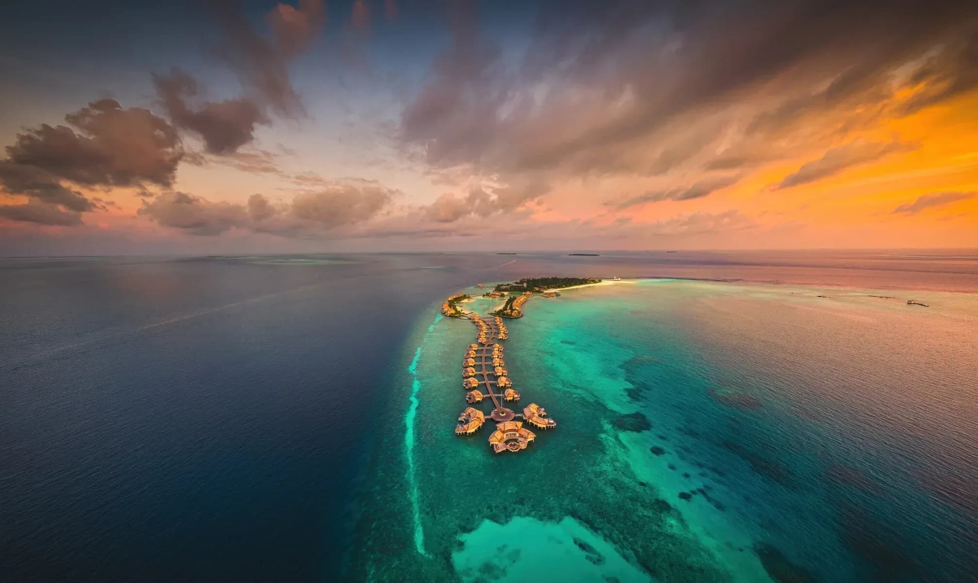 Aerial view of Maamunagau Island's reef and turquoise lagoon, InterContinental Maldives