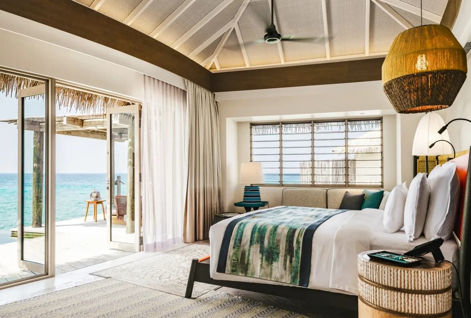 Overwater Pool Villa deck and private infinity pool at InterContinental Maldives Maamunagau Resort