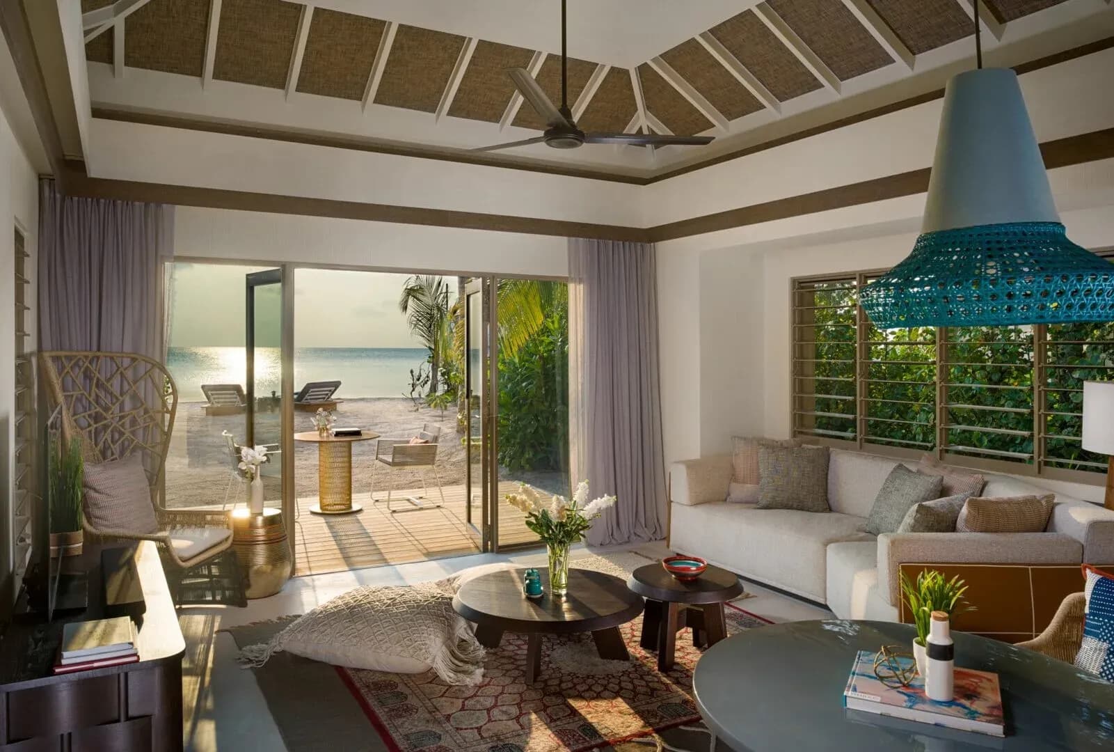 Two Bedroom Family Beach Pool Villa living room opening to the private pool