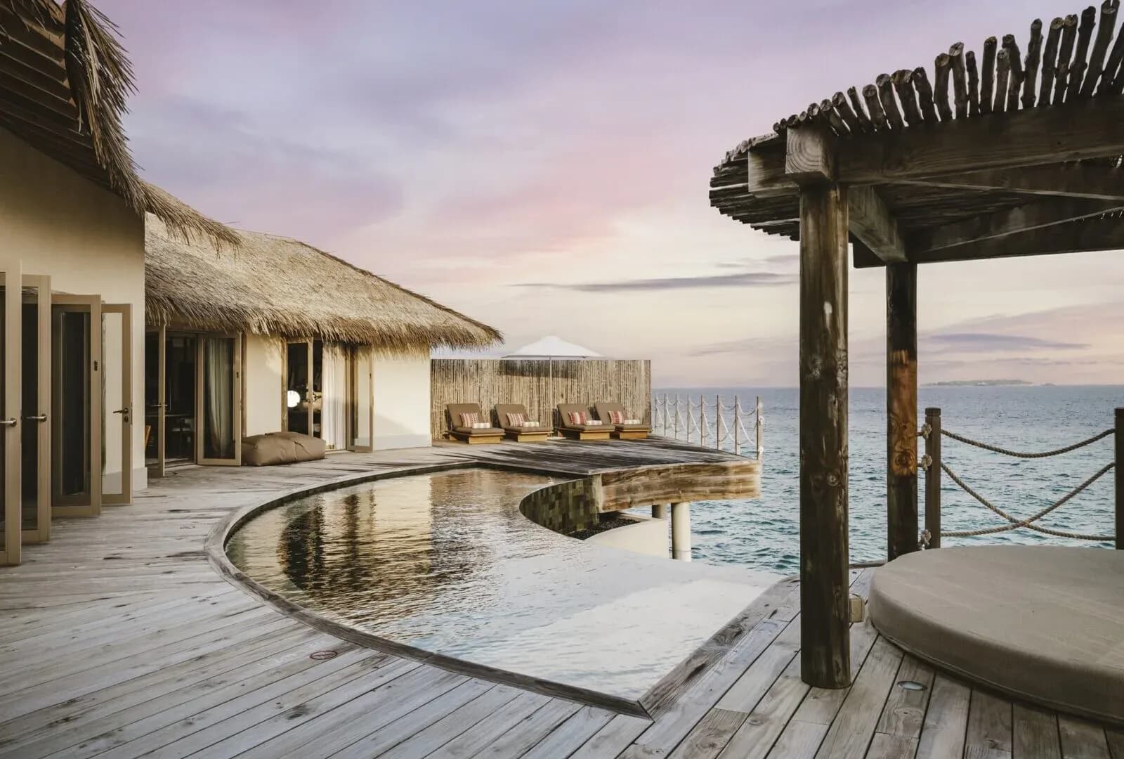 Two Bedroom Overwater Pool Residence deck and infinity pool over the ocean