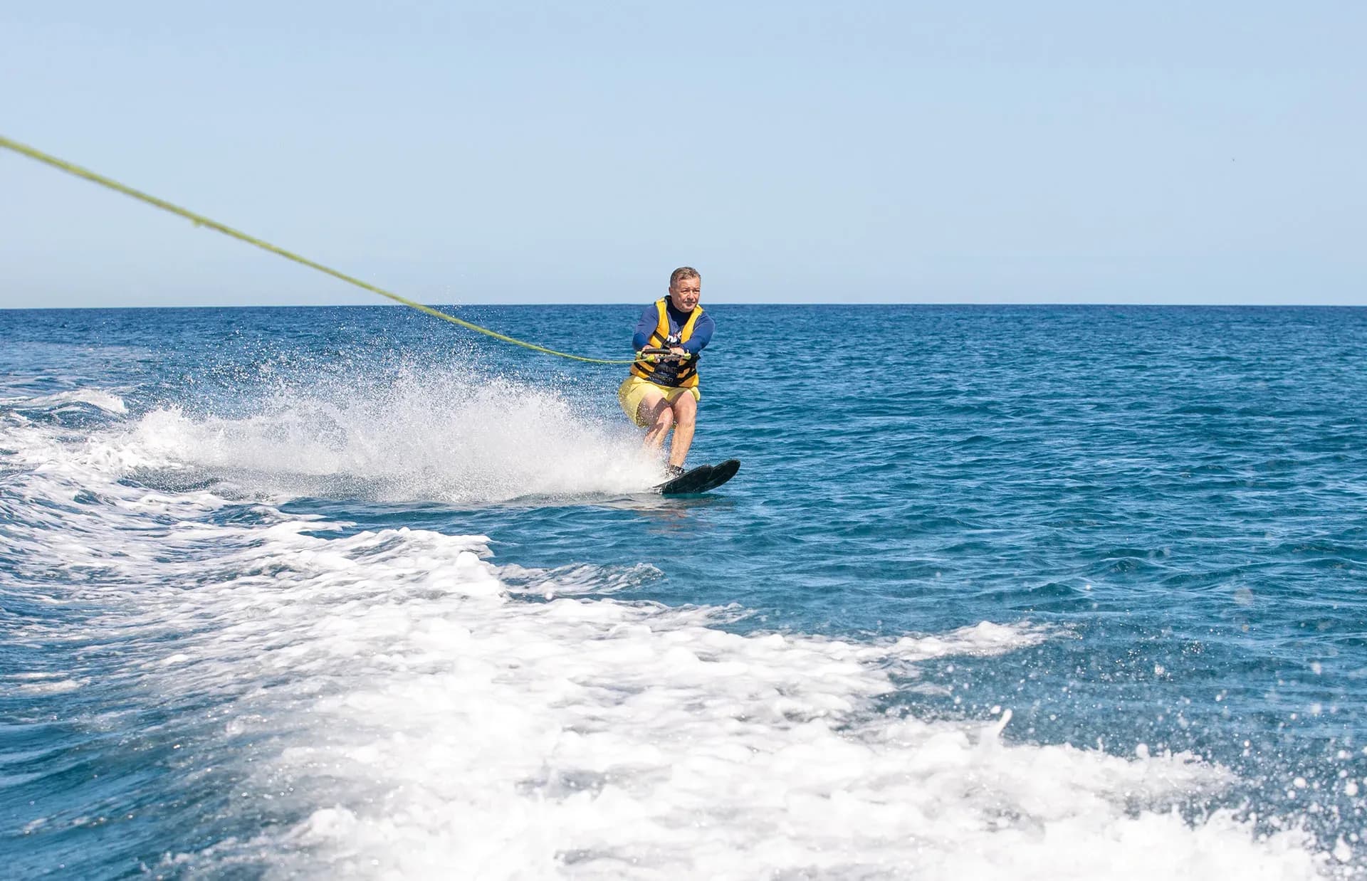 Guest waterskiing off the resort's Boat House at InterContinental Mauritius Resort Balaclava Fort