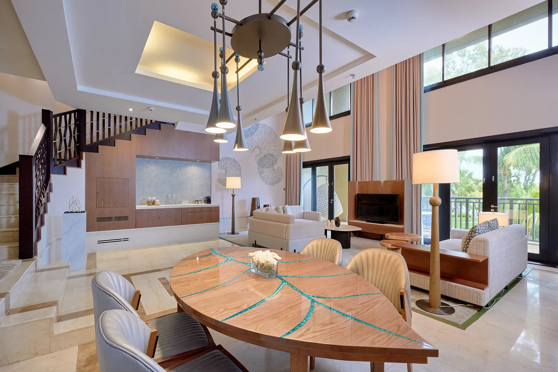 Presidential Duplex Suite living and dining area with staircase to the upper level at InterContinental Mauritius Resort Balaclava Fort