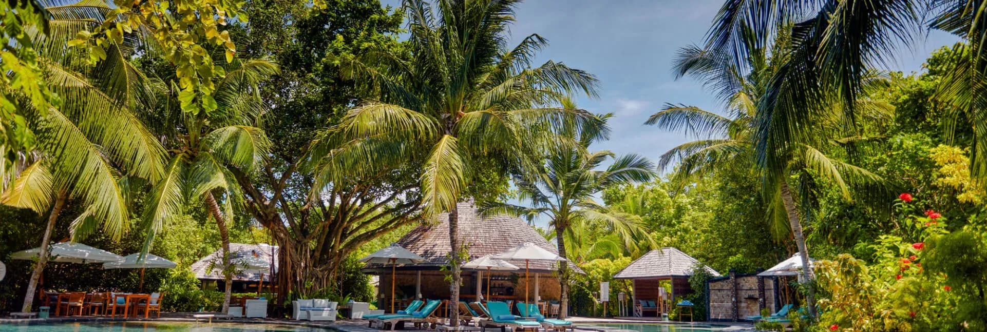 Andiamo Bistro and Pool dining setting beside the Jungle Pool at JA Manafaru