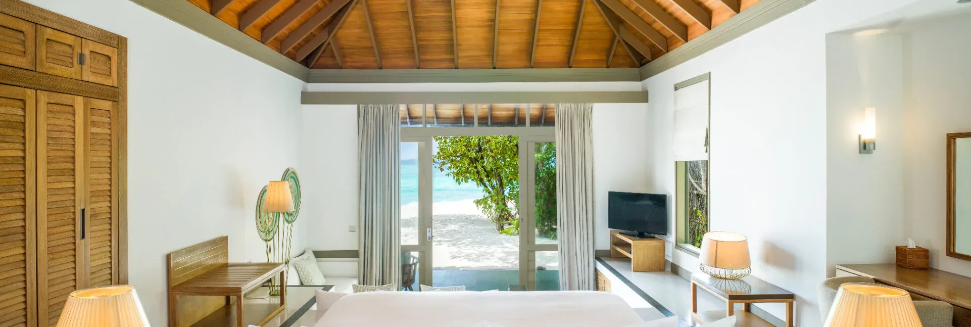 Beach Villa with Private Pool bedroom at JA Manafaru