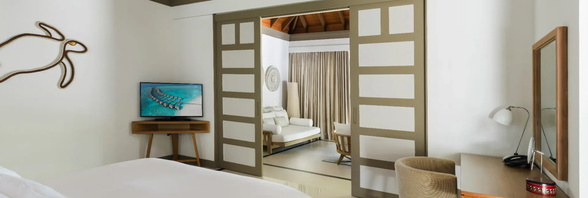 Deluxe Beach Villa with Private Family Pool bedroom at JA Manafaru