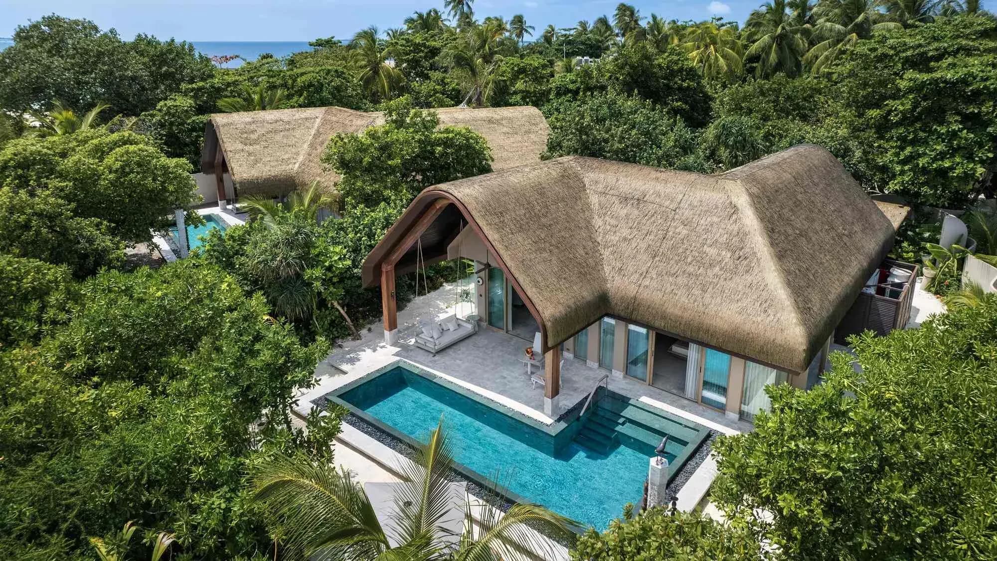 Aerial view of a Grand Beach Pool Villa and its garden pool, JOALI BEING