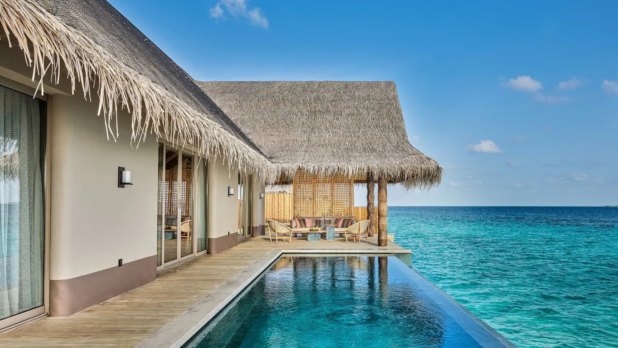 Luxury Sunset Water Villa with Pool at sunset, JOALI Maldives