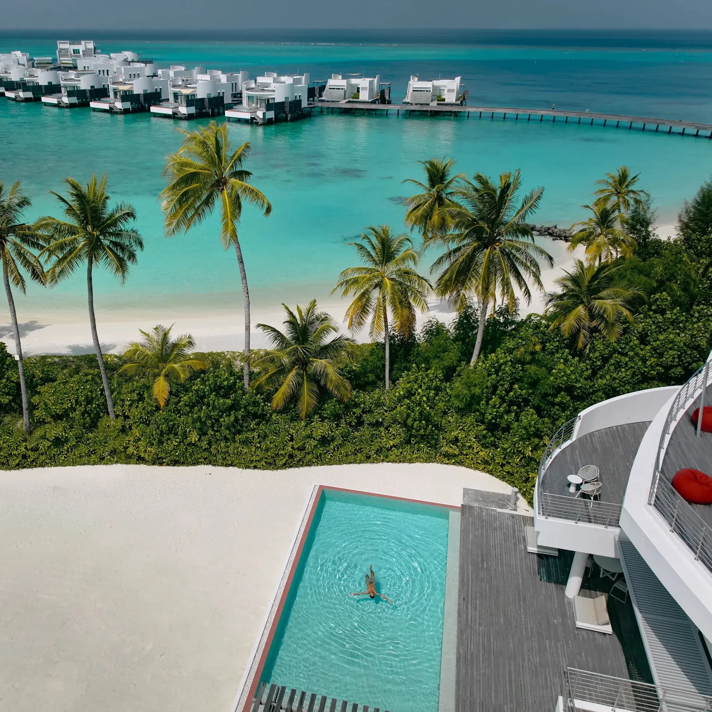 Aerial drone view of Jumeirah Olhahali Island's villas and lagoon