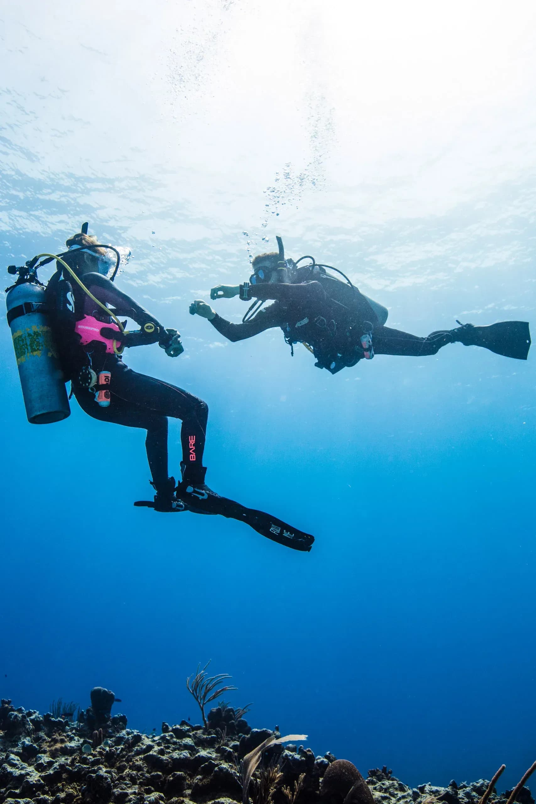 MSTS dive instructors and guest exploring the reef at Kagi Maldives