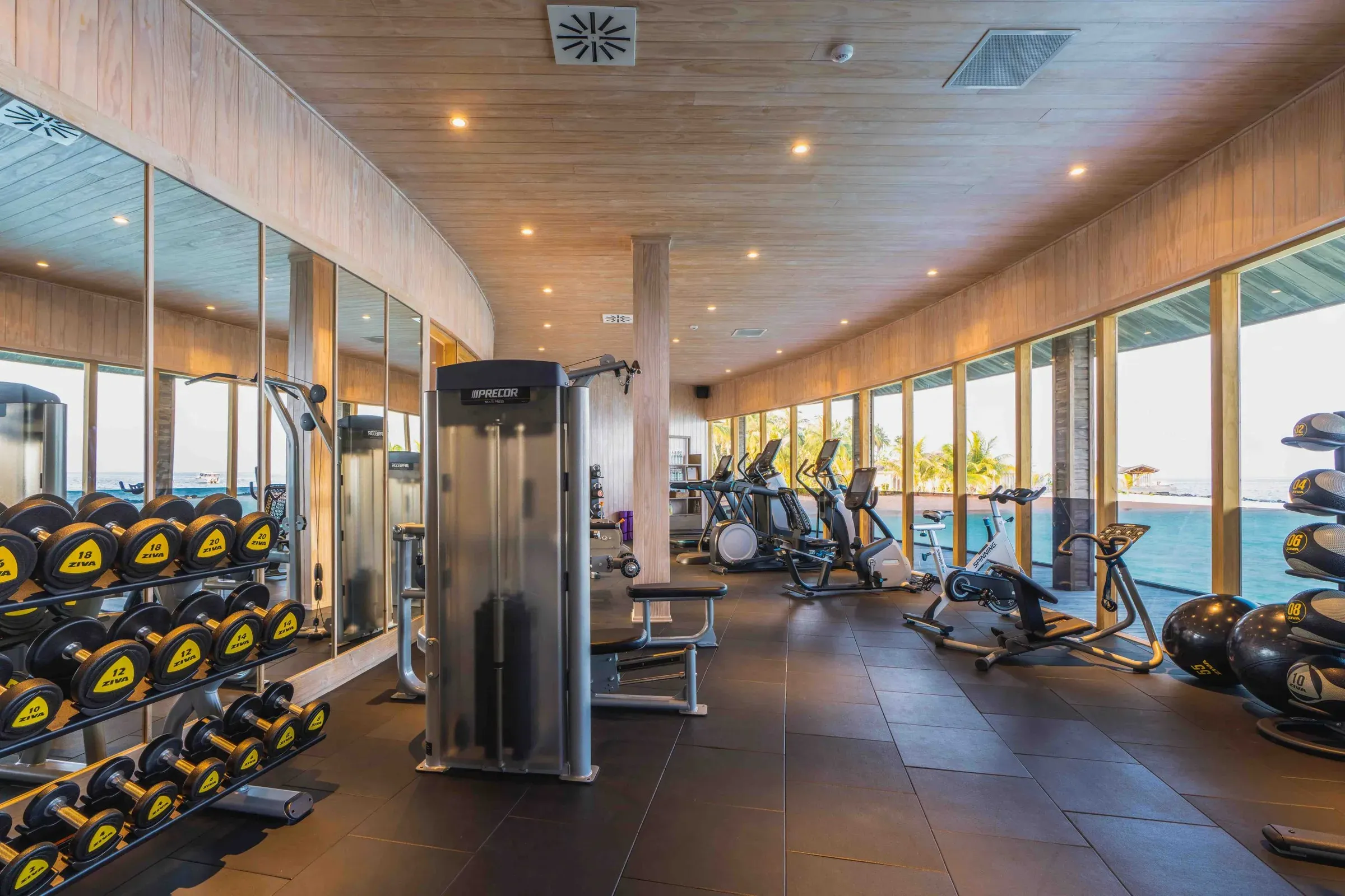 Overwater Fitness Centre with Precor equipment and ocean views at Kagi Maldives