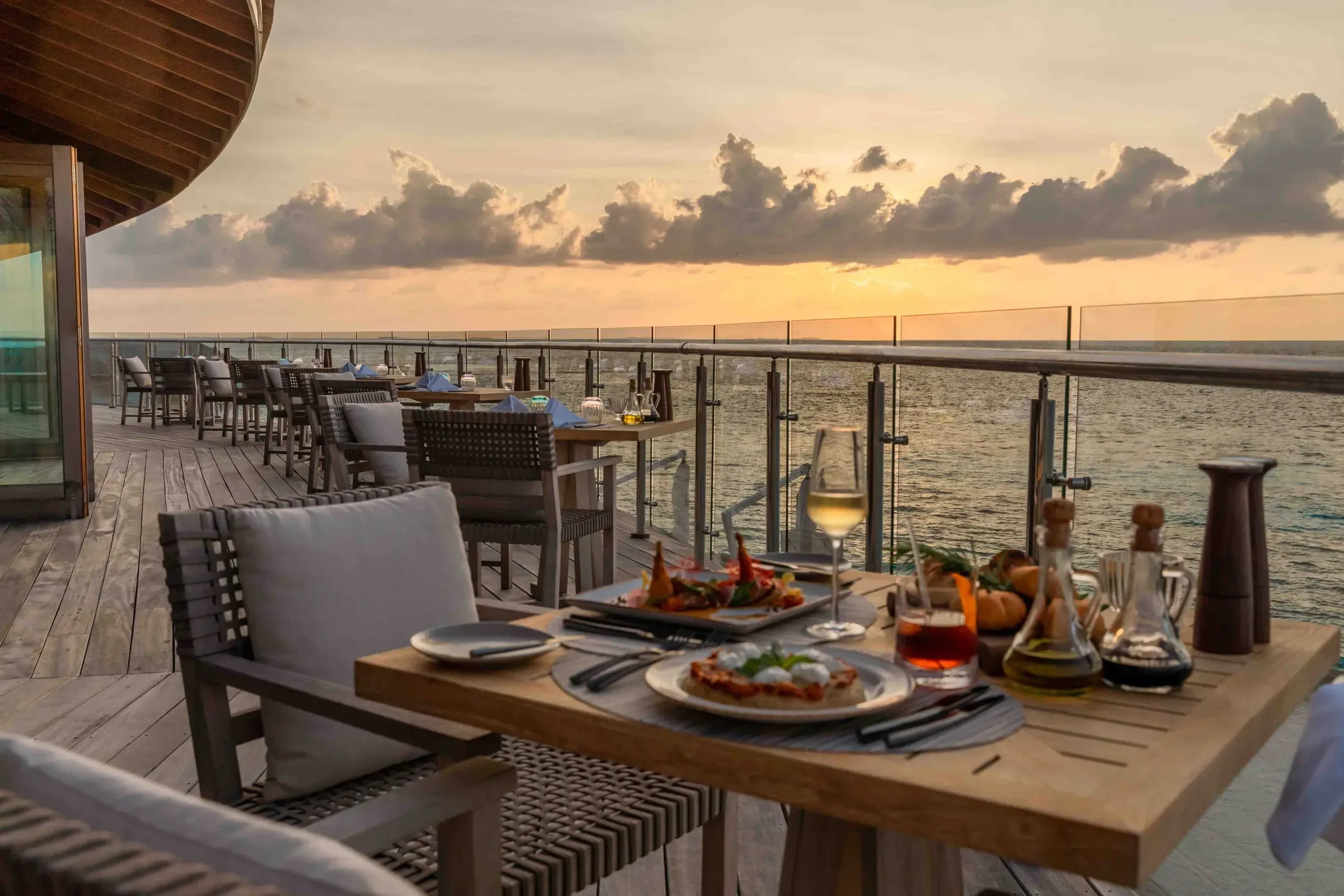 Sunset terrace dining with Italian dishes at Nonna restaurant, Kagi Maldives