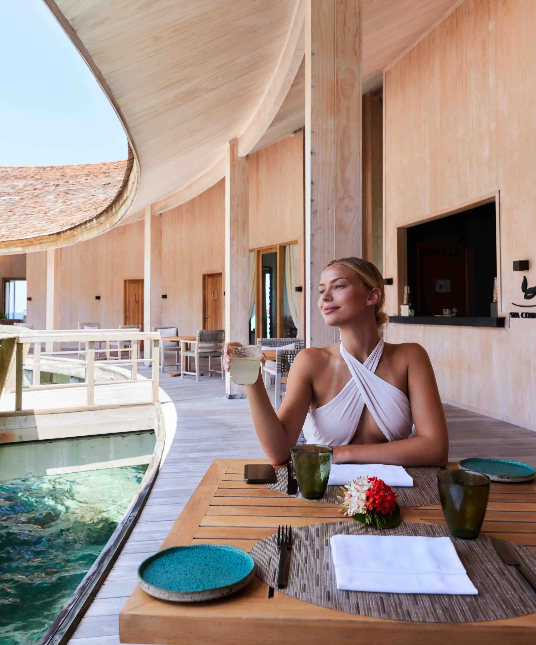 Guest dining beside the pool deck at Spa Corner, Baani Spa, Kagi Maldives