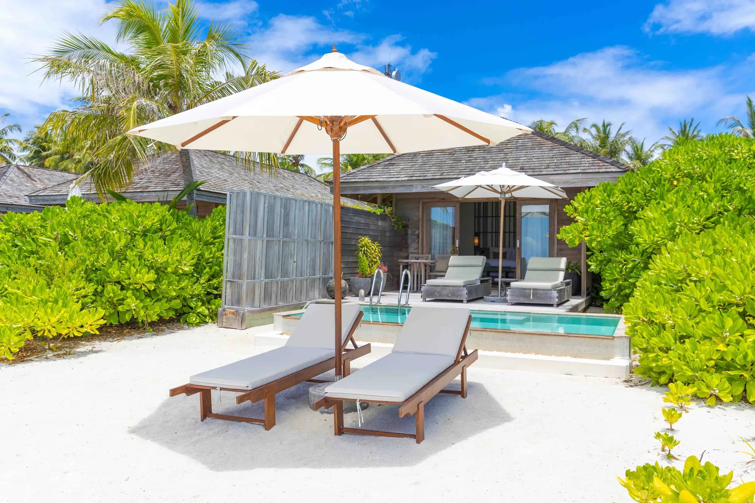 Beach Pool Villa private pool and sun loungers on the beach at Kagi Maldives