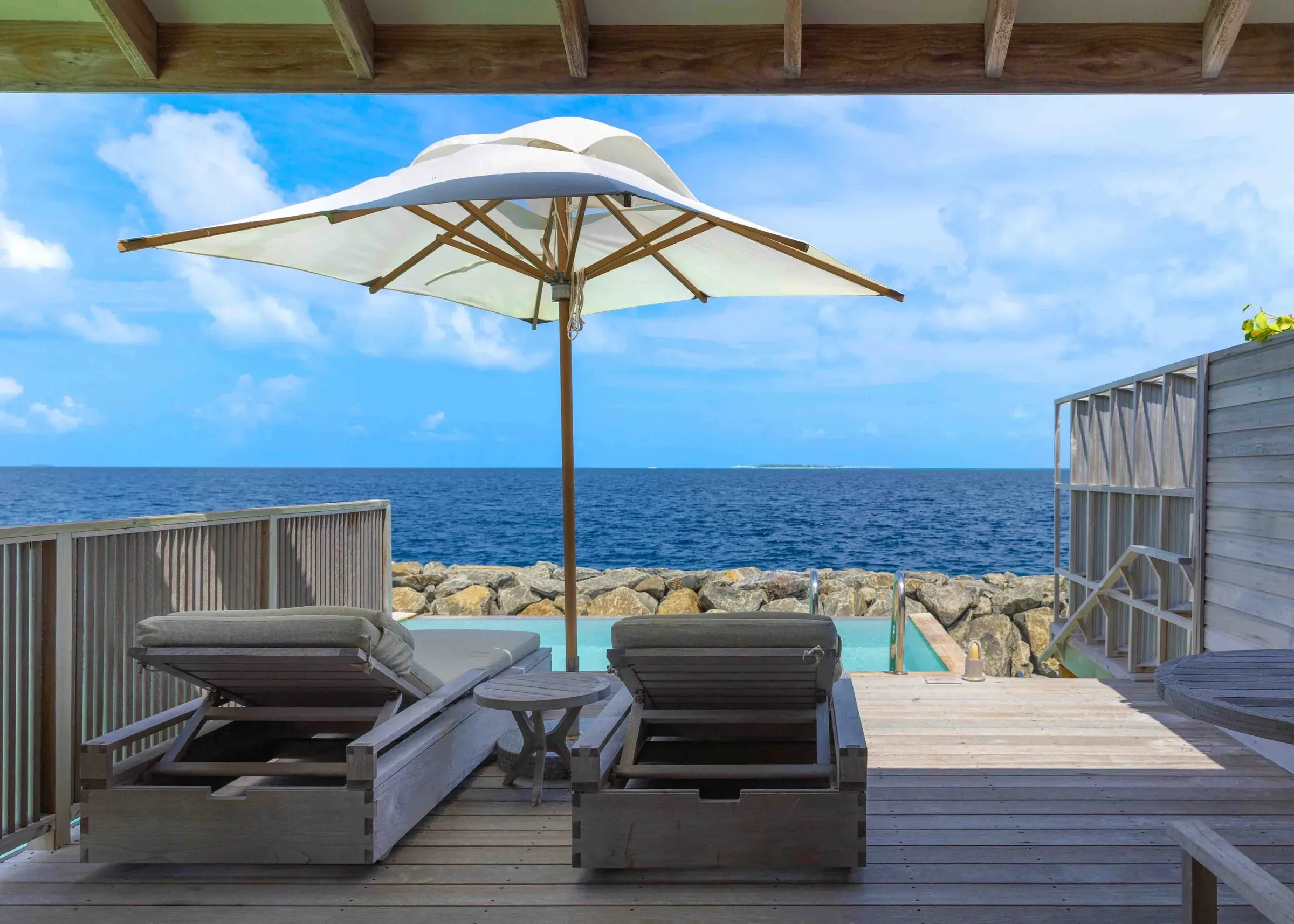 Ocean Pool Villa deck and plunge pool overlooking the reef at Kagi Maldives