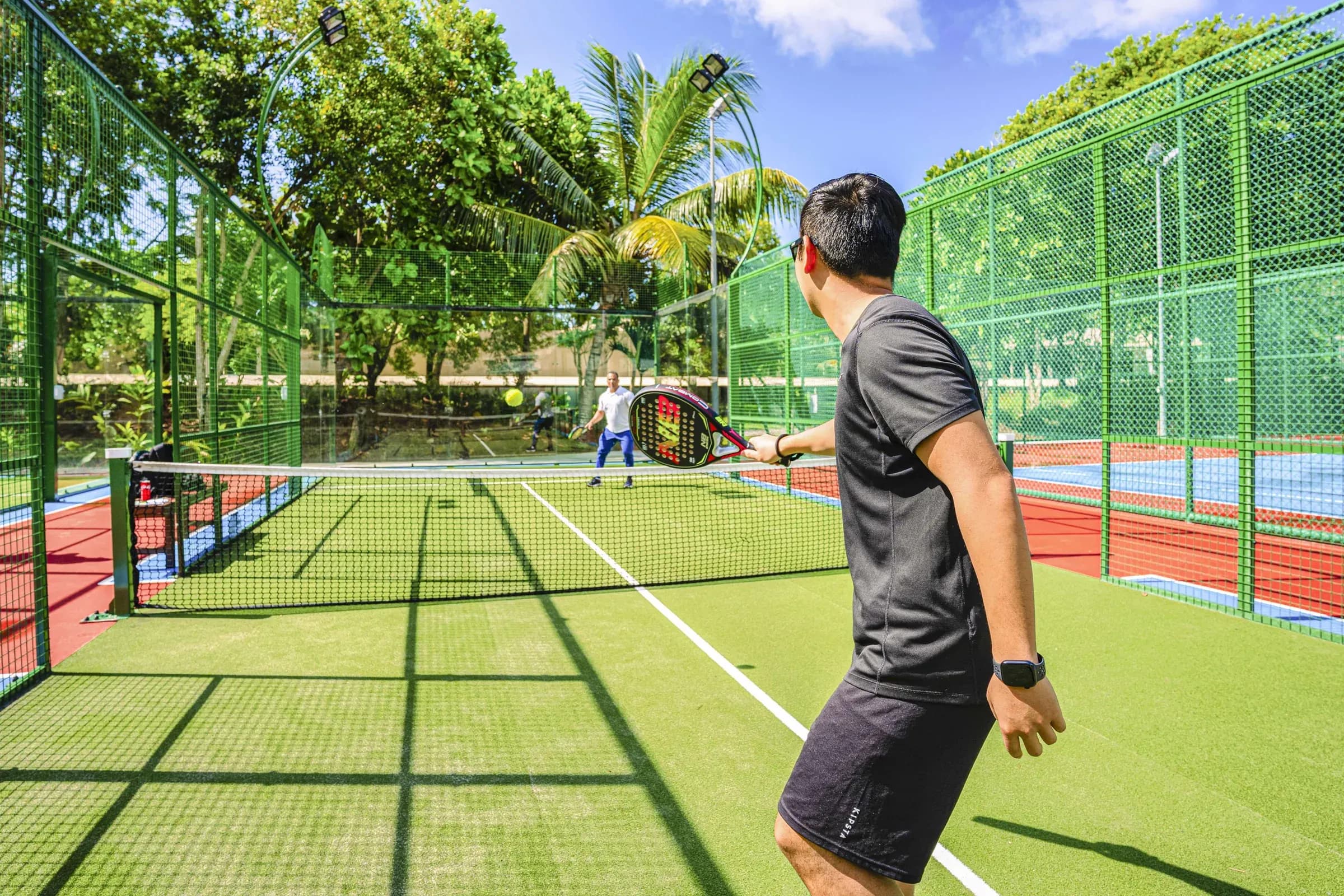 Floodlit paddle and tennis courts at Kempinski Seychelles Resort