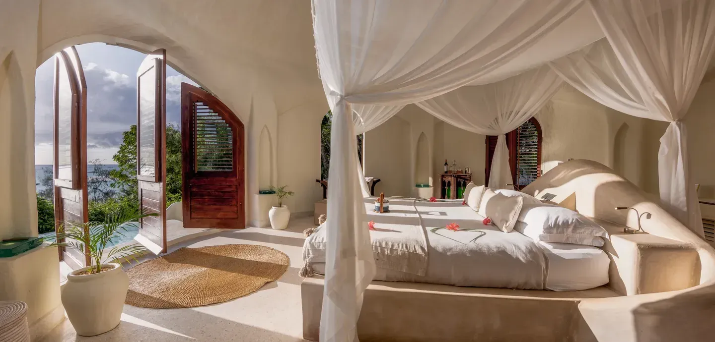 Luxury Ocean View Villa at Kilindi Zanzibar with arched doors open to the sea and plunge pool