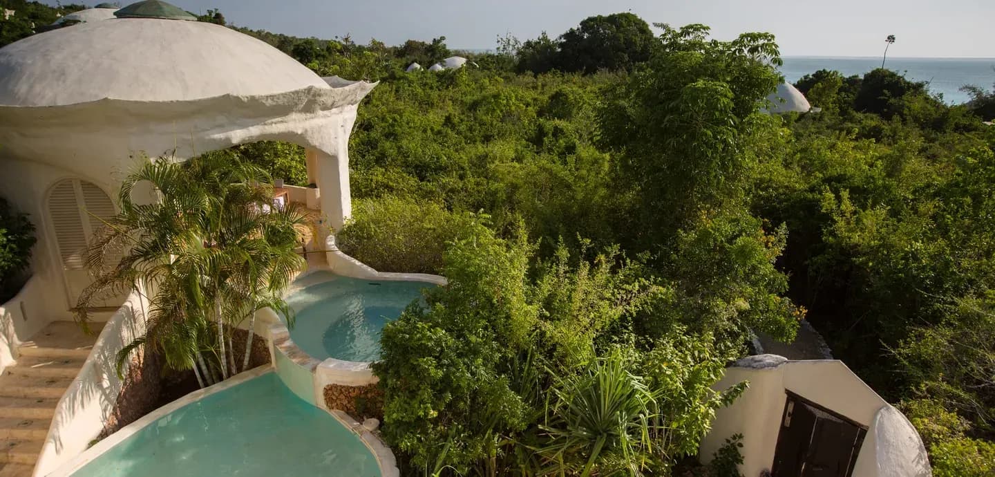 Aerial view of a Two-Bedroom Garden View Villa's domed roof and two private plunge pools at Kilindi Zanzibar