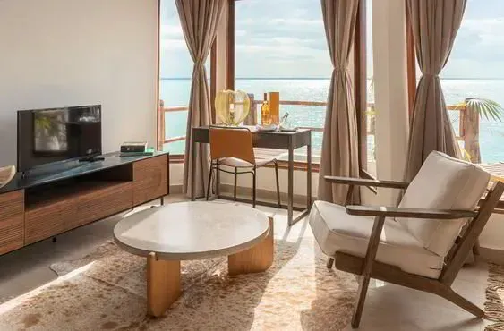 Isaraya Luxury Overwater Villa living space with ocean views over Chwaka Bay