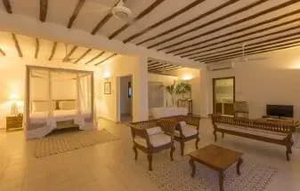 Sea View Villa interior with lagoon views through the terrace doors at Konokono Beach Resort