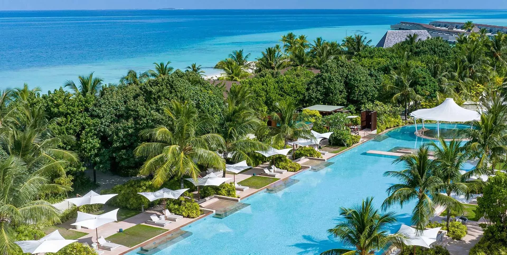 Aerial view of the 150-metre swimming pool at Kuda Villingili Resort Maldives, the largest pool in the Maldives