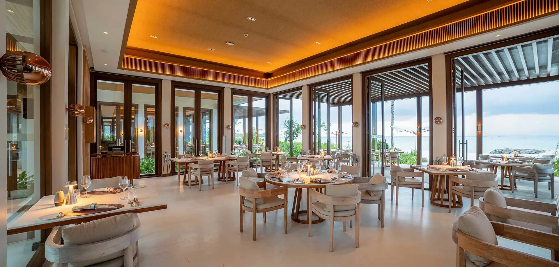 Ocean-view dining room at Earth, the plant-based restaurant at Kuda Villingili Resort Maldives
