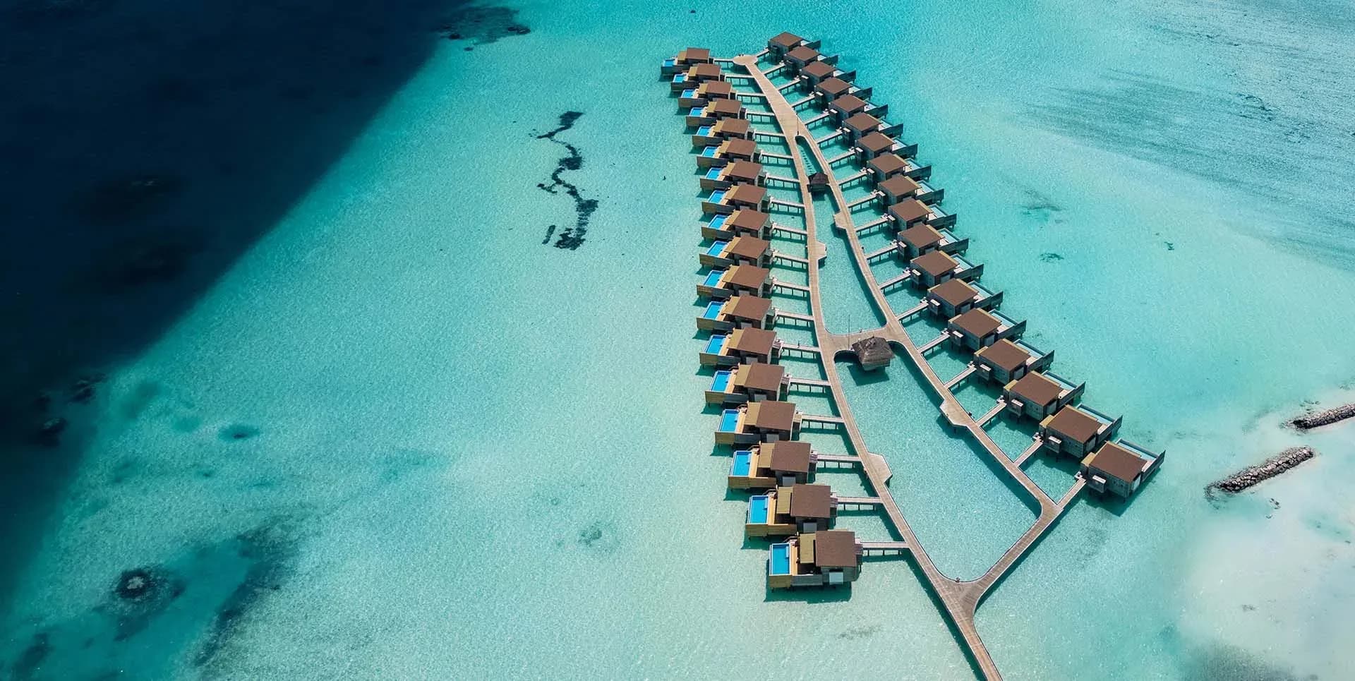Sunrise Water Villa with Private Pool over the lagoon at Kuda Villingili Resort Maldives