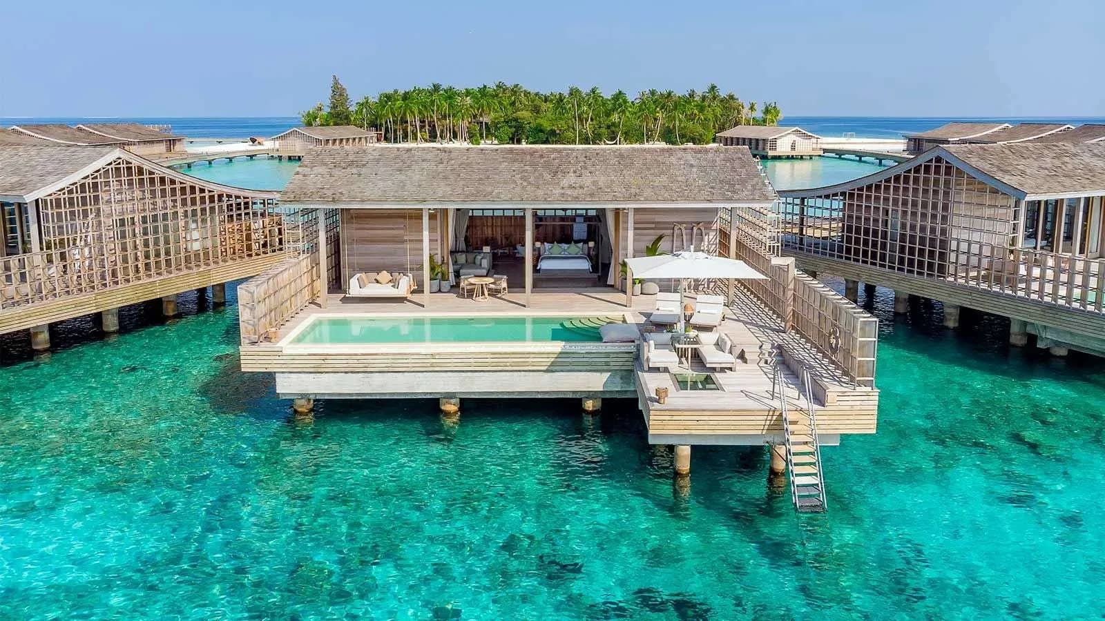Aerial view of an overwater residence with private infinity plunge pool at Kudadoo Maldives Private Island, Lhaviyani Atoll