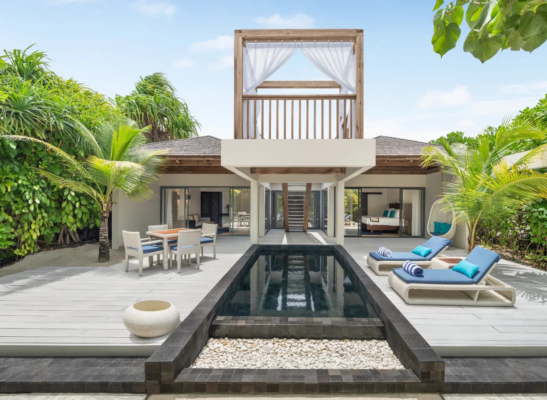 Exterior of a Beach Pool Villa Deluxe set within tropical gardens at Kuredhivaru Resort and Spa